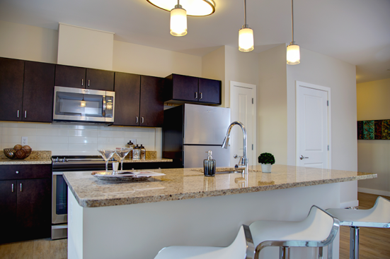 In addition to the housing and commercial space, a fitness center and a resident lounge are located on the first floor.