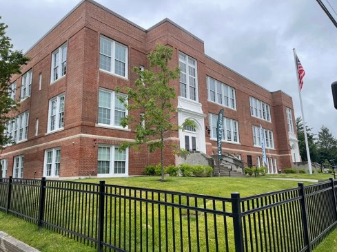 After sitting vacant for eight years, a century-old school building has been adapted into affordable housing in Southbridge, Massachusetts.