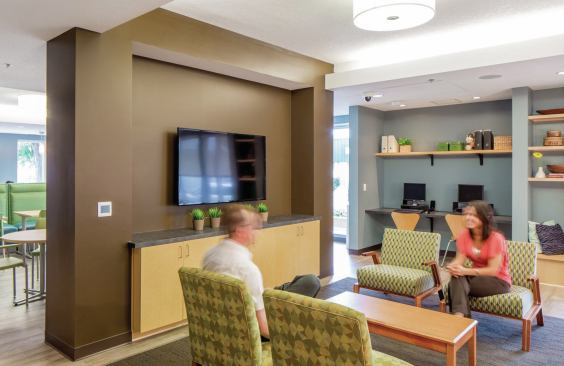 Gathering spaces create opportunities for residents and Touchstone Mental Health staff to easily and naturally interact.