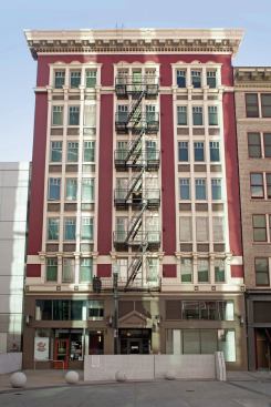 The construction joined the two buildings at the ground level to preserve three commercial spaces and create a central lobby, a community room, services office, and a computer room. Partial and gut renovations created 101 studio apartments, each with a kitchenette and a bathroom, as well as commercial space.