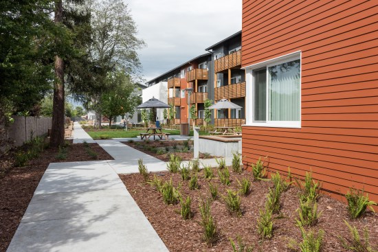 The LEED Platinum community's design supports a goal of healthy living, with a continuing pathway surrounding the property and a fitness center. 