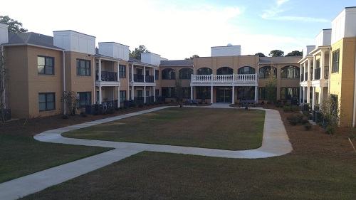 Instead of creating one large building, the developers built two smaller, connected buildings that create a courtyard and address neighborhood concerns.