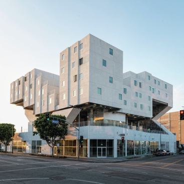 Developed by Skid Row Housing Trust, the Star Apartments is instantly distinguishable with 102 pre-fabricated modular units placed intricately on a cantilevered podium structure in Los Angeles.