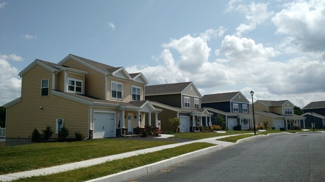 Homes at the $13.5 million development resemble farmhouses as part of the community's agricultural focus.