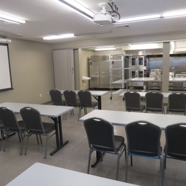 The development features a demonstration kitchen, where cooking classes help residents gain skills to live on their own and to work in the culinary industry.