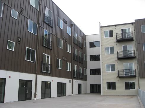 Rooftop photovoltaic panels generate 56,500 kWh of electricity annually, and the building’s elevators use just one-third of the energy required for hydraulic lifts.
