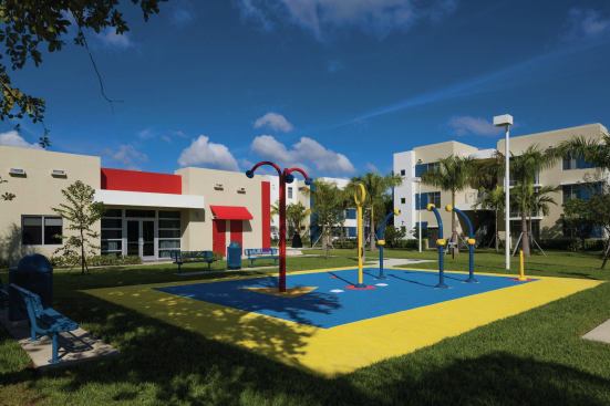 Developed by the Pinnacle Housing Group, the community encourages resident interaction through multiple playgrounds, picnic areas, basketball courts, walking paths, and a splash pad.