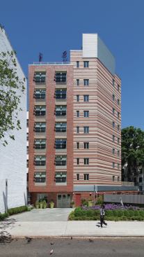 The $15.3 million development features 32 studios for formerly homeless individuals and 20 for low-income individuals.