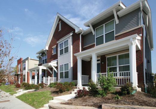 The project features new, historically representative townhouses and garden apartments.