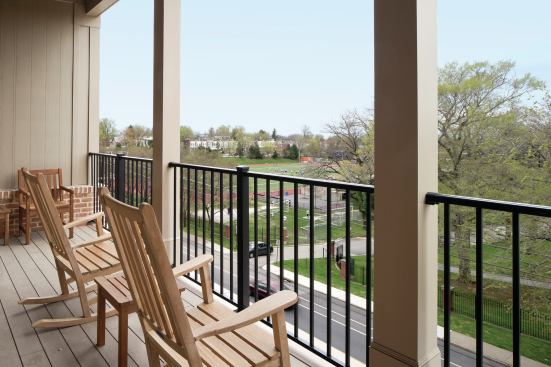 Residents can look out over the Mount Saint Joseph High School athletic fields across the street from the project. The landscaping incorporates the school colors, purple and cream.