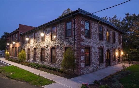 The historic Heaton & Cowing Mill in Providence, R.I., has been converted into 20 apartments for veterans earning up to 50% of the area median income.