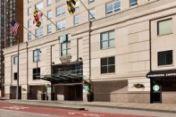 A former Embassy Suites that shuttered during the COVID-19 pandemic is being converted into apartments with the help of the Opportunity Zone program.